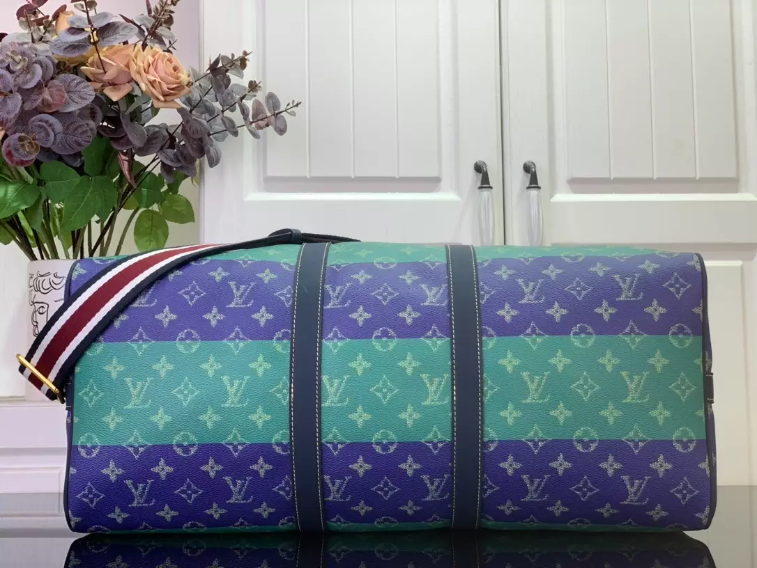 KEEPALL BANDOULIÈRE 50 LOUIS VUITTON HERITAGE - LW454 DISCOVERY BACKPACK PM SKY BLUE MONOGRAM CANVAS